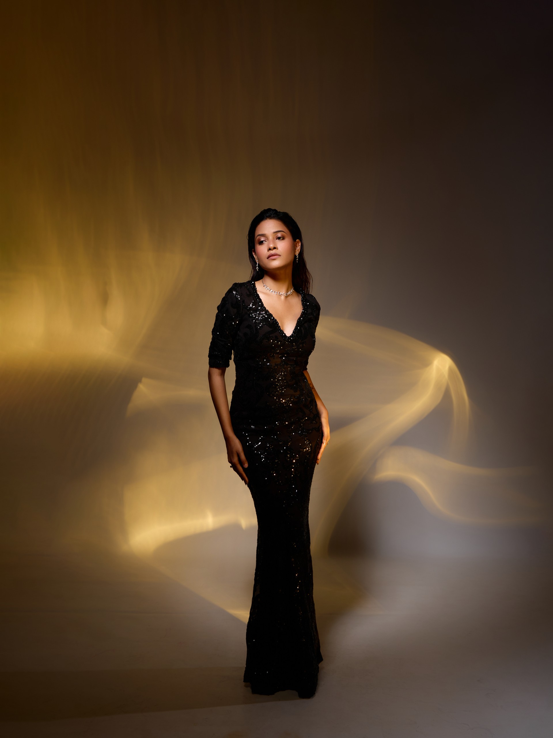 Glamorous Portrait with Shimmering Gold Background
