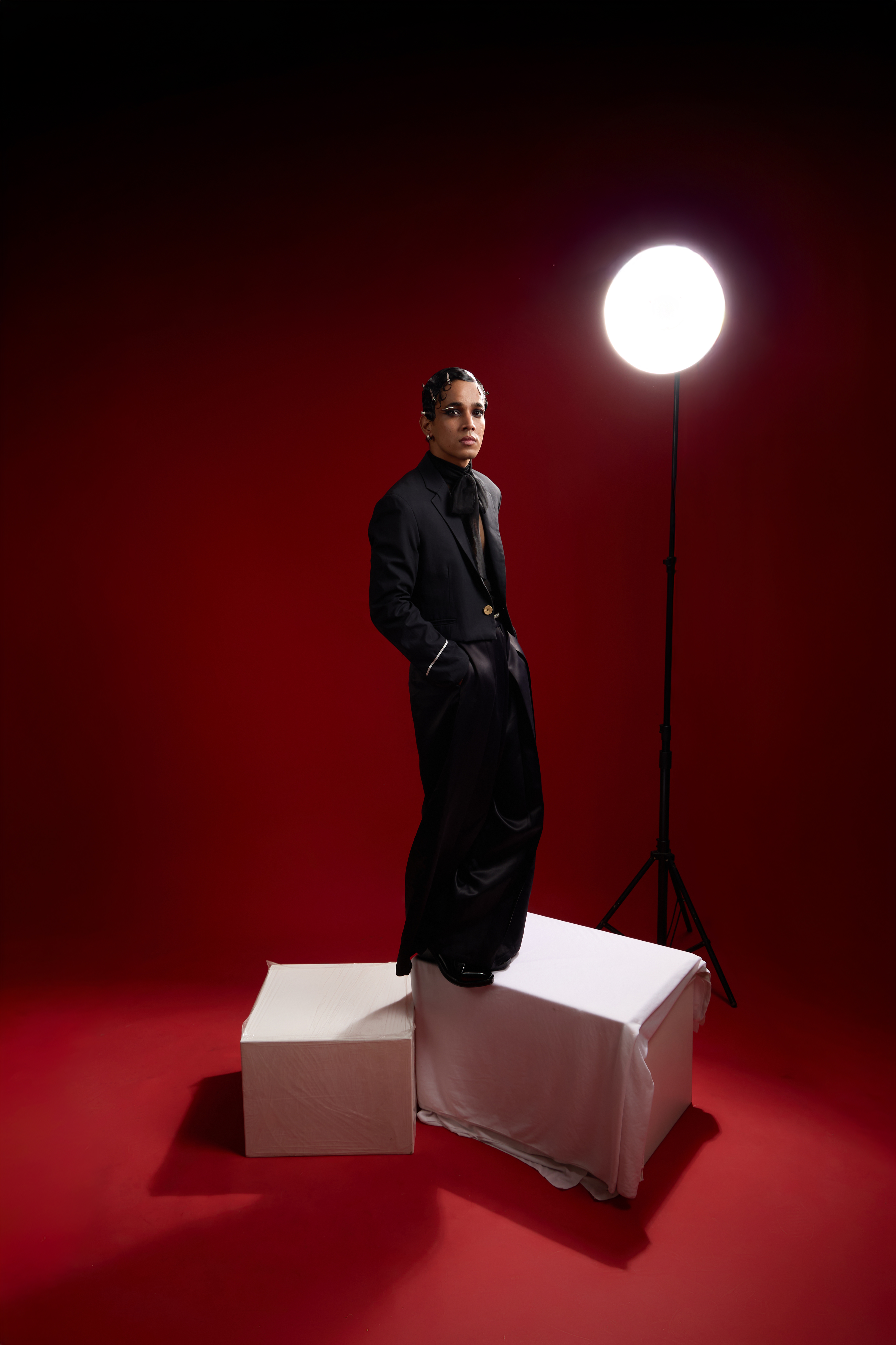 Fashion Portrait with Overhead Key and Rim Light on Red